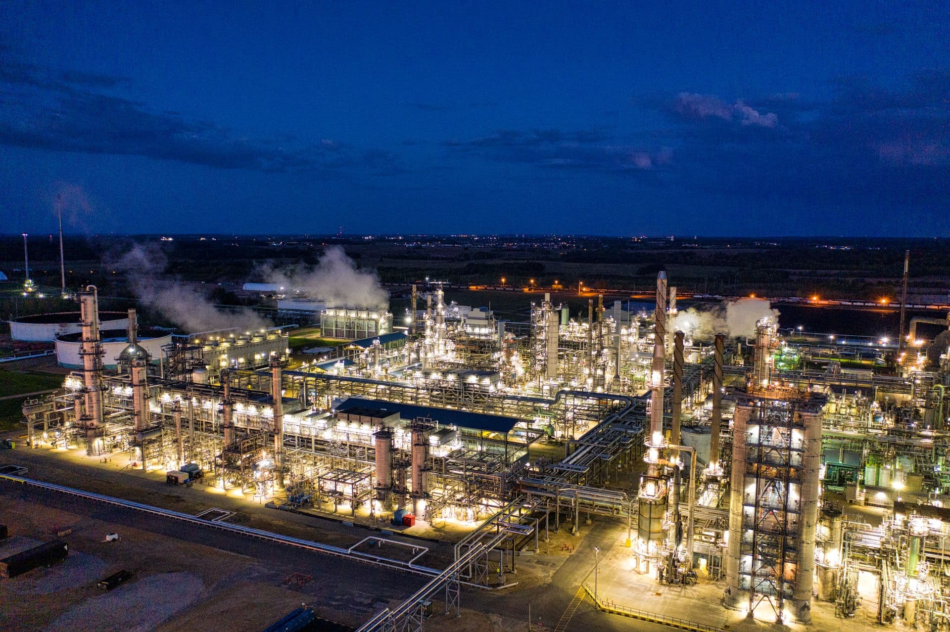 Oil refinery illuminated at night